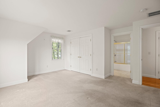 47 Cove View Dr, South Yarmouth, MA 02664 - unfurnished bedroom with carpet, baseboards, and a closet