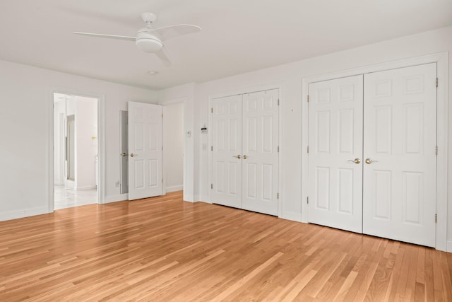 47 Cove View Dr, South Yarmouth, MA 02664 - unfurnished bedroom with two closets, light wood-style floors, baseboards, and ceiling fan