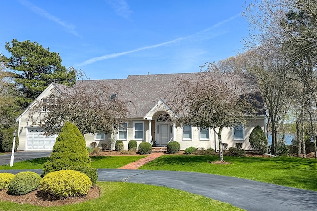 47 Cove View Dr, South Yarmouth, MA 02664 - view of front of home featuring asphalt driveway, a front lawn, and a garage
