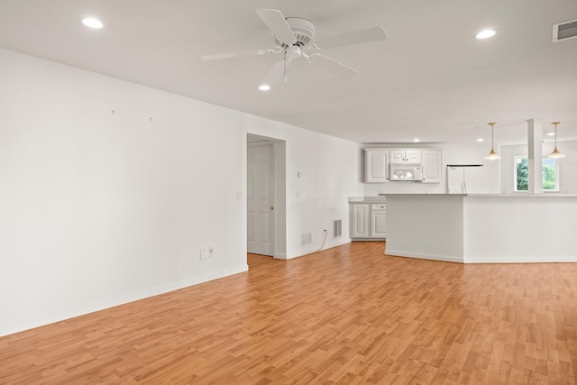 47 Cove View Dr, South Yarmouth, MA 02664 - unfurnished living room featuring light wood finished floors, ceiling fan, recessed lighting, and baseboards