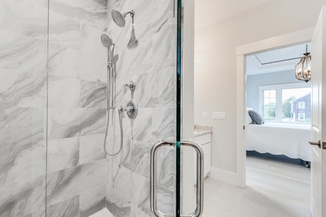 bathroom featuring a notable chandelier and walk in shower