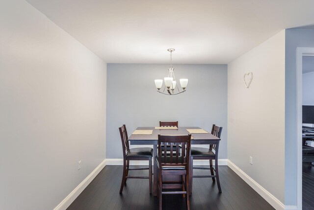 2 Marc Dr Unit 2B2, Plymouth, MA 02360 - dining room featuring a chandelier, baseboards, and dark wood finished floors