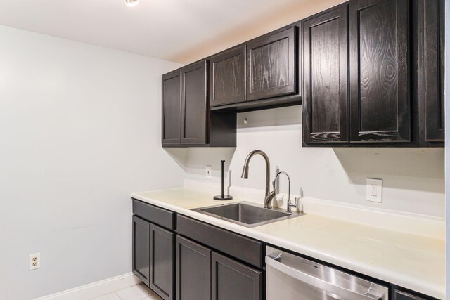 2 Marc Dr Unit 2B2, Plymouth, MA 02360 - kitchen with dark brown cabinets, dishwasher, light countertops, a sink, and baseboards