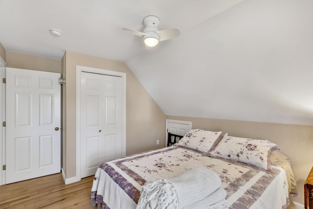 51 Buccaneer Way, Mashpee, MA 02649 - bedroom featuring light wood-style flooring, vaulted ceiling, a closet, ceiling fan, and baseboards