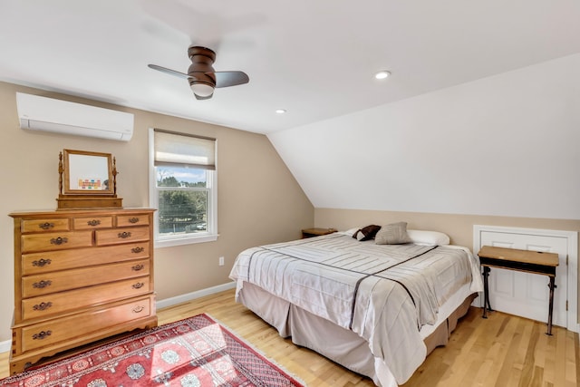51 Buccaneer Way, Mashpee, MA 02649 - bedroom with a wall mounted AC, light wood-style floors, lofted ceiling, baseboards, and ceiling fan