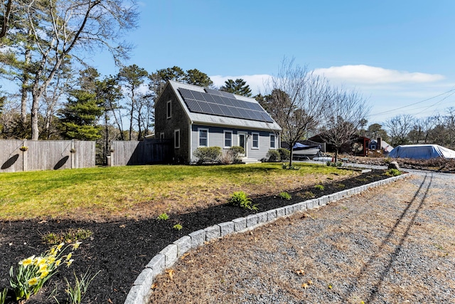 51 Buccaneer Way, Mashpee, MA 02649 - view of front of house featuring solar panels, dirt driveway, and roof with shingles