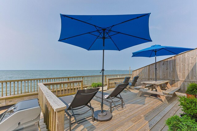 334 Shore Rd # 1, Truro, MA 02666 - wooden terrace with a water view and outdoor dining area