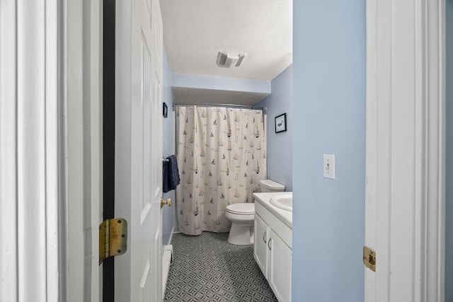 bathroom featuring toilet, curtained shower, tile patterned flooring, a textured ceiling, and vanity