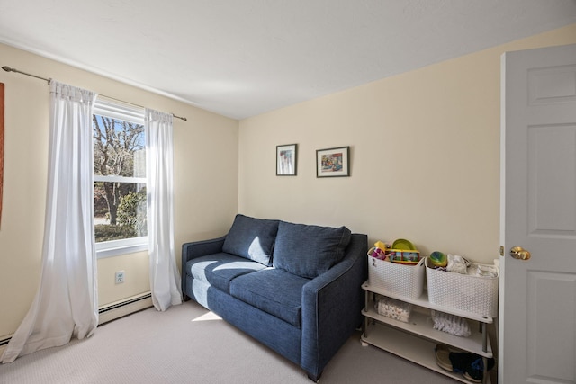 living area featuring baseboard heating and light colored carpet