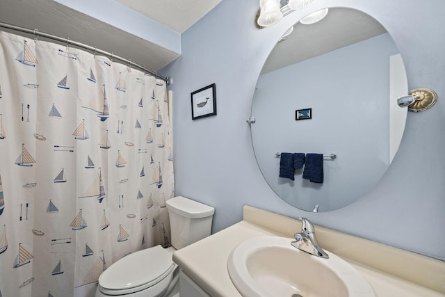 full bathroom with toilet, curtained shower, and vanity