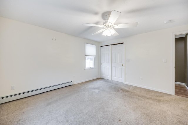 105 Edgewater Dr W, East Falmouth, MA 02536 - unfurnished bedroom featuring a baseboard heating unit, carpet, baseboards, and a closet