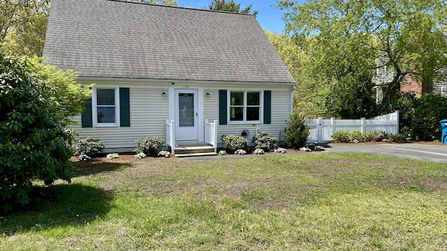 105 Edgewater Dr W, East Falmouth, MA 02536 - new england style home with roof with shingles
