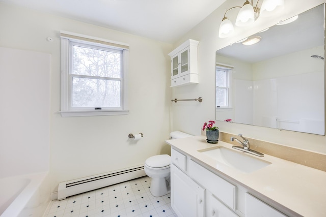 105 Edgewater Dr W, East Falmouth, MA 02536 - bathroom featuring a baseboard heating unit, healthy amount of natural light, toilet, and tile patterned floors