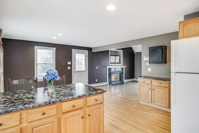105 Edgewater Dr W, East Falmouth, MA 02536 - kitchen featuring freestanding refrigerator, light brown cabinetry, light wood-style flooring, a fireplace, and recessed lighting