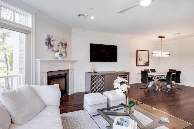 66 Simons Rd Unit C, Mashpee, MA 02649 - living room featuring wood finished floors, ornamental molding, a high end fireplace, a ceiling fan, and a chandelier