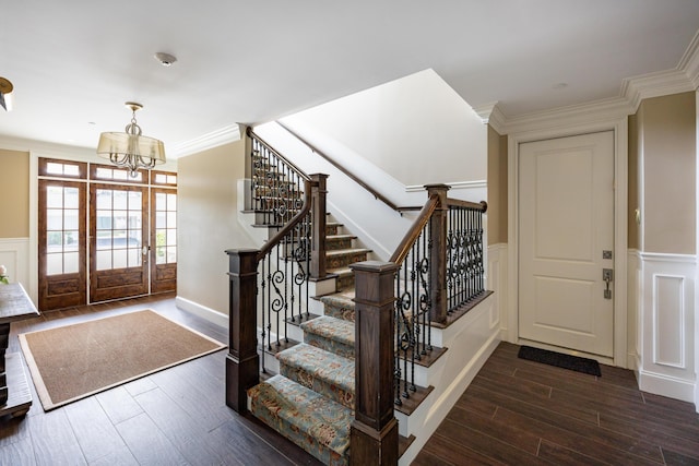 66 Simons Rd Unit C, Mashpee, MA 02649 - foyer with wood finished floors, stairs, a chandelier, wainscoting, and a decorative wall