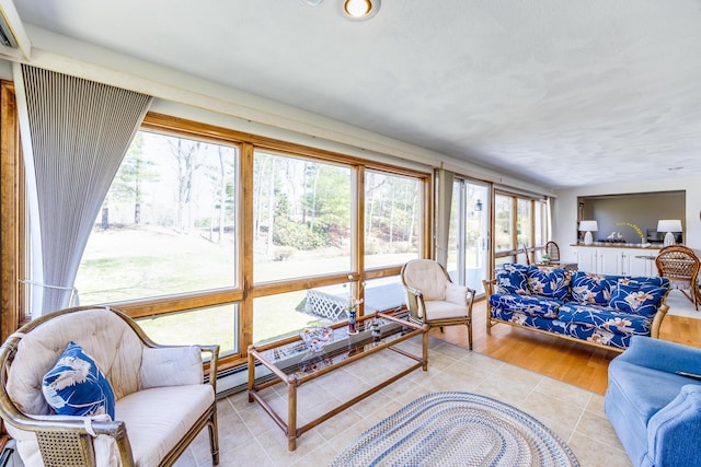 living room with light tile patterned floors and a baseboard radiator