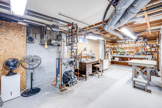 unfinished basement with a workshop area and a heating unit