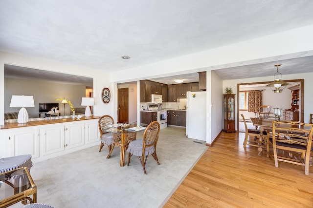 dining room featuring light wood-type flooring