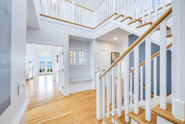 foyer featuring a high ceiling and hardwood / wood-style floors