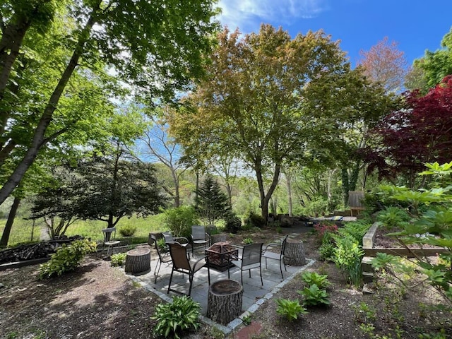 114 Stoney Cliff Rd, Centerville, MA 02632 - view of patio / terrace with a fire pit