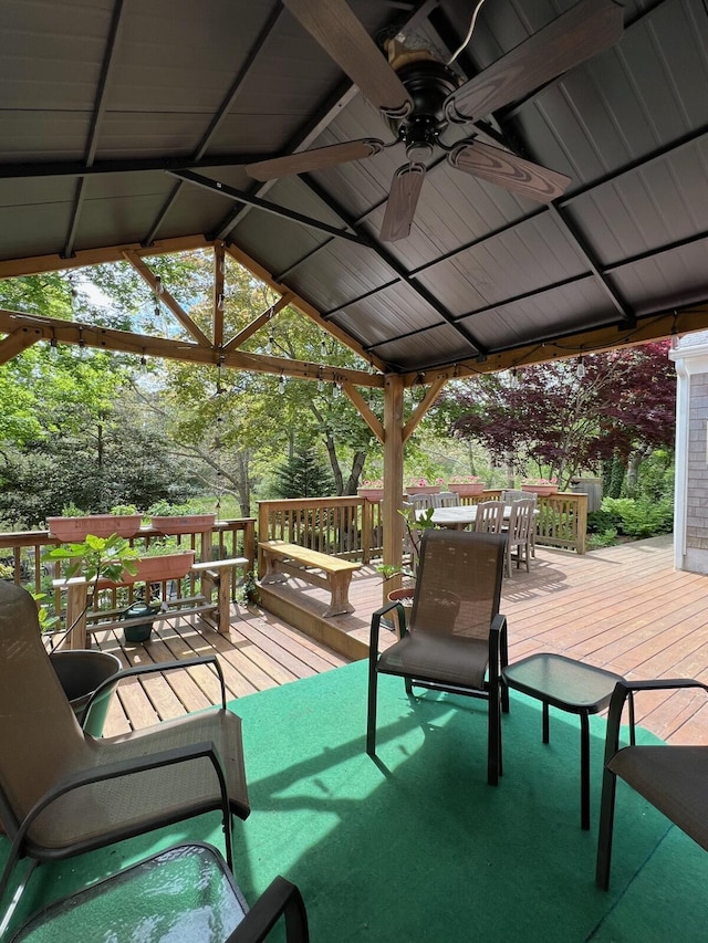 114 Stoney Cliff Rd, Centerville, MA 02632 - wooden terrace with a ceiling fan, outdoor dining space, and a gazebo