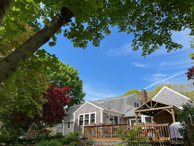 114 Stoney Cliff Rd, Centerville, MA 02632 - back of property featuring a gazebo, a wooden deck, and a chimney