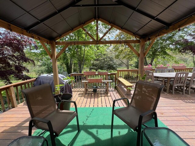 114 Stoney Cliff Rd, Centerville, MA 02632 - wooden deck featuring outdoor dining space, a gazebo, and view of scattered trees
