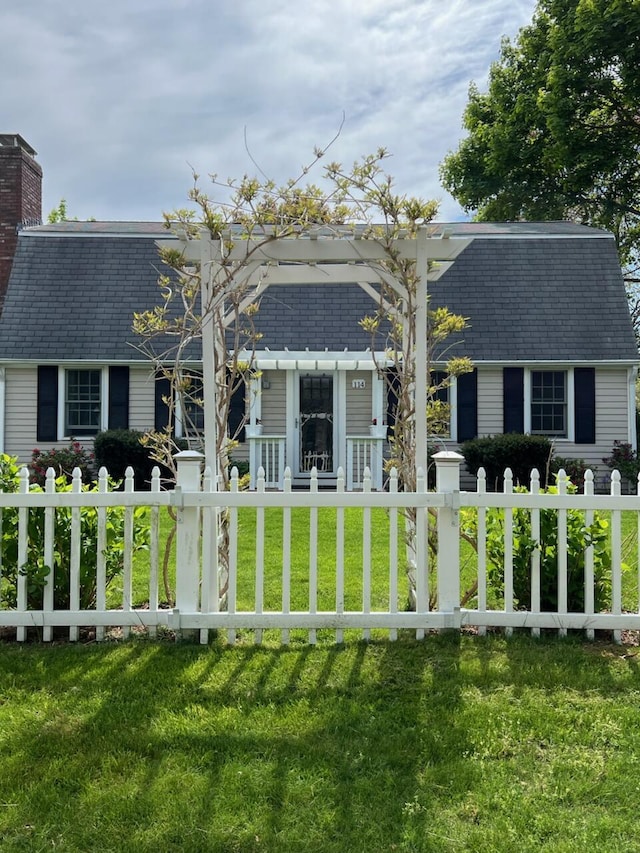 114 Stoney Cliff Rd, Centerville, MA 02632 - back of house with a chimney and roof with shingles