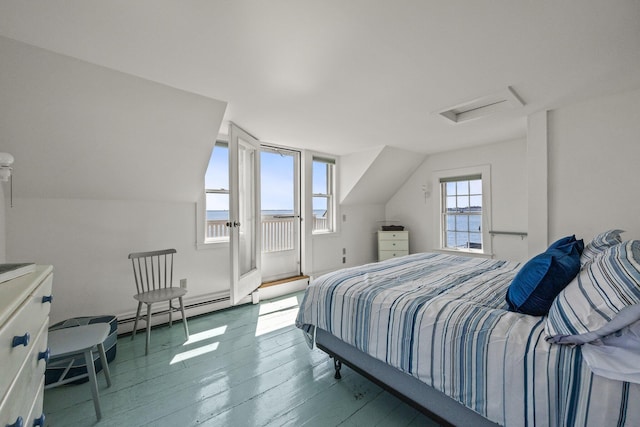 561 Commercial St, Provincetown, MA 02657 - bedroom with attic access, access to outside, a baseboard radiator, and hardwood / wood-style floors