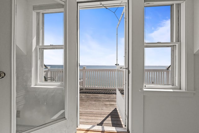 561 Commercial St, Provincetown, MA 02657 - doorway with a water view and wood finished floors