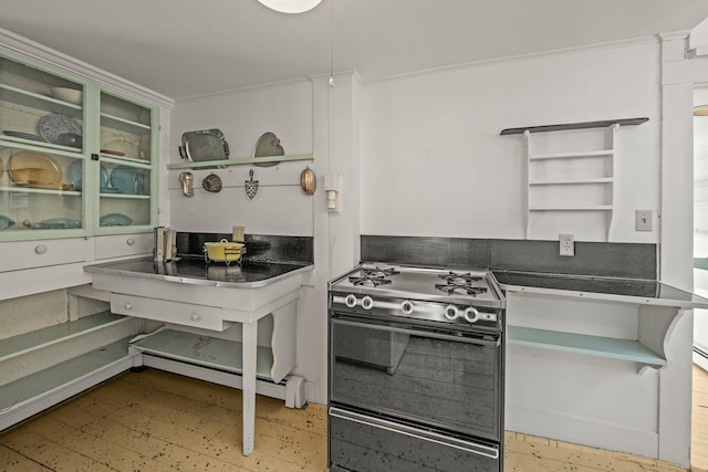 561 Commercial St, Provincetown, MA 02657 - kitchen featuring ornamental molding, dark countertops, open shelves, and stove