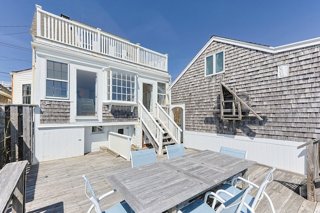 561 Commercial St, Provincetown, MA 02657 - back of house featuring a wooden deck, stairs, outdoor dining area, and a balcony