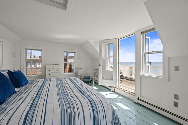561 Commercial St, Provincetown, MA 02657 - bedroom featuring a water view, access to exterior, a baseboard heating unit, and wood finished floors
