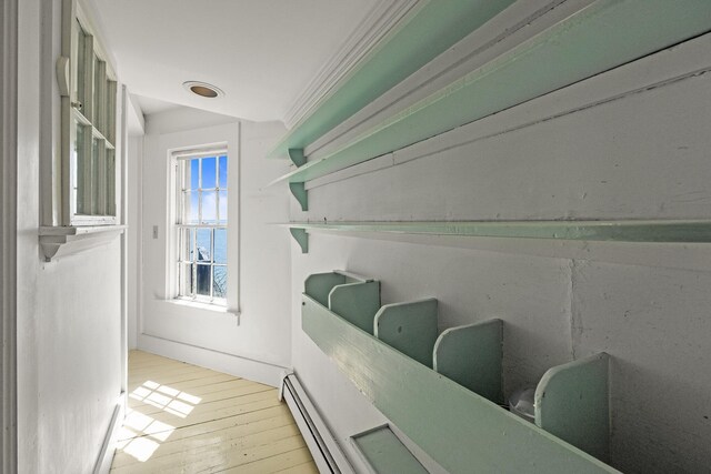 561 Commercial St, Provincetown, MA 02657 - interior details with a baseboard radiator and wood finished floors