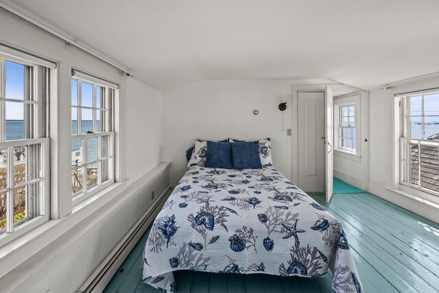 561 Commercial St, Provincetown, MA 02657 - bedroom with a water view, wood-type flooring, multiple windows, and vaulted ceiling