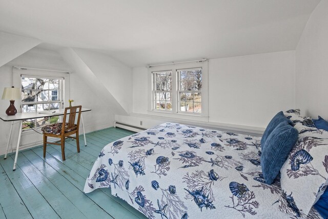 561 Commercial St, Provincetown, MA 02657 - bedroom featuring baseboard heating, wood finished floors, and lofted ceiling