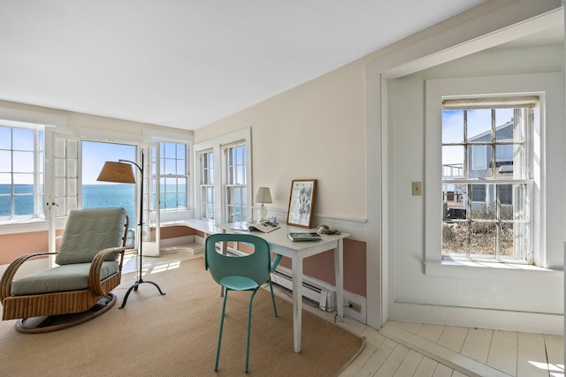 561 Commercial St, Provincetown, MA 02657 - office area featuring a baseboard heating unit, baseboards, and a water view