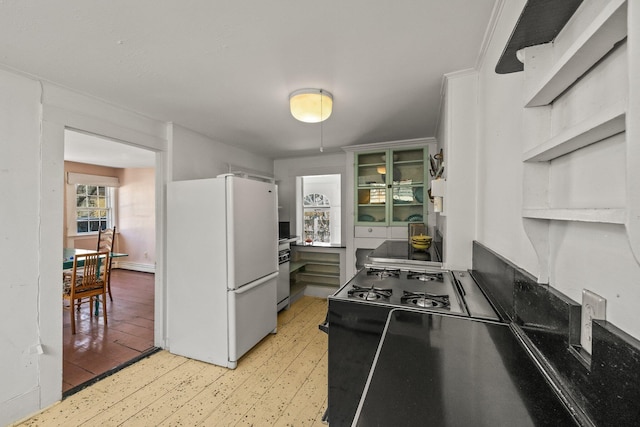 561 Commercial St, Provincetown, MA 02657 - kitchen featuring light wood-style floors and freestanding refrigerator