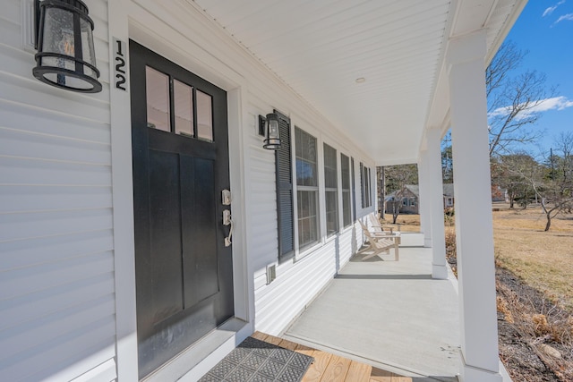 view of exterior entry featuring a porch