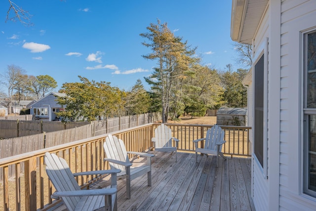 wooden deck featuring fence