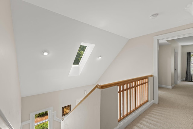 152 Algonquin Ave, Mashpee, MA 02649 - corridor with a skylight, light carpet, an upstairs landing, and vaulted ceiling