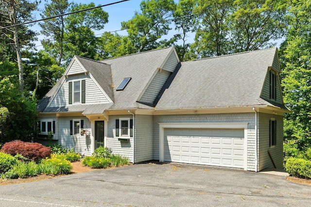152 Algonquin Ave, Mashpee, MA 02649 - shingle-style home featuring a shingled roof, a garage, and driveway
