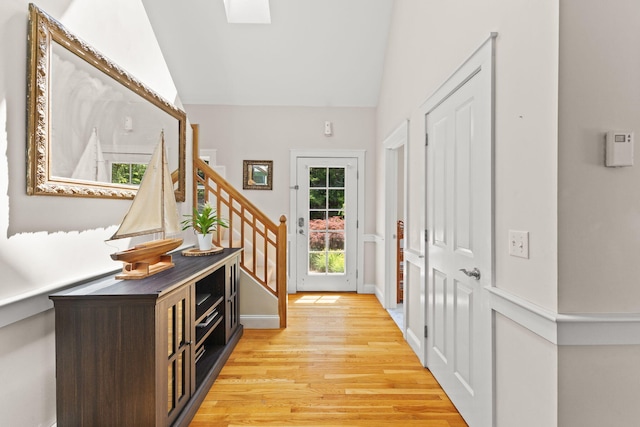 152 Algonquin Ave, Mashpee, MA 02649 - foyer entrance with light wood-style floors, lofted ceiling, and stairway