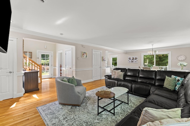 152 Algonquin Ave, Mashpee, MA 02649 - living area with a chandelier, light wood finished floors, stairway, and ornamental molding