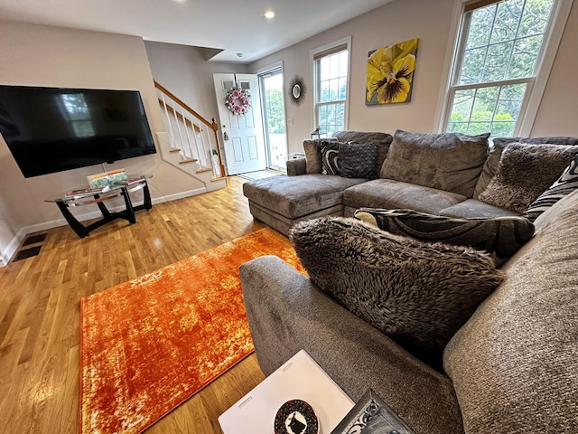 121 Camp St Unit 108, West Yarmouth, MA 02673 - living area with stairs, wood finished floors, baseboards, and recessed lighting