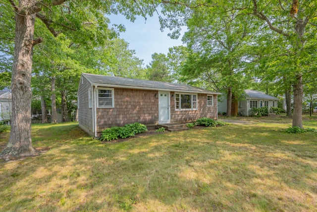 64 Uncle Percys Rd, Mashpee, MA 02649 - view of front of home featuring a front lawn