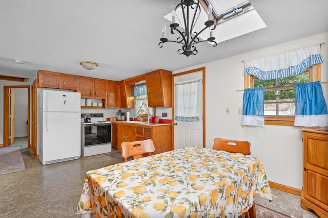 64 Uncle Percys Rd, Mashpee, MA 02649 - dining room featuring healthy amount of natural light, a skylight, a chandelier, and tile patterned floors