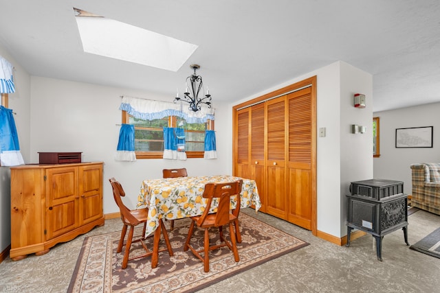 64 Uncle Percys Rd, Mashpee, MA 02649 - dining area with a skylight, baseboards, and a chandelier