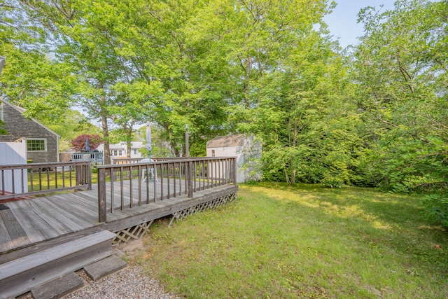 64 Uncle Percys Rd, Mashpee, MA 02649 - view of grassy yard with a wooden deck